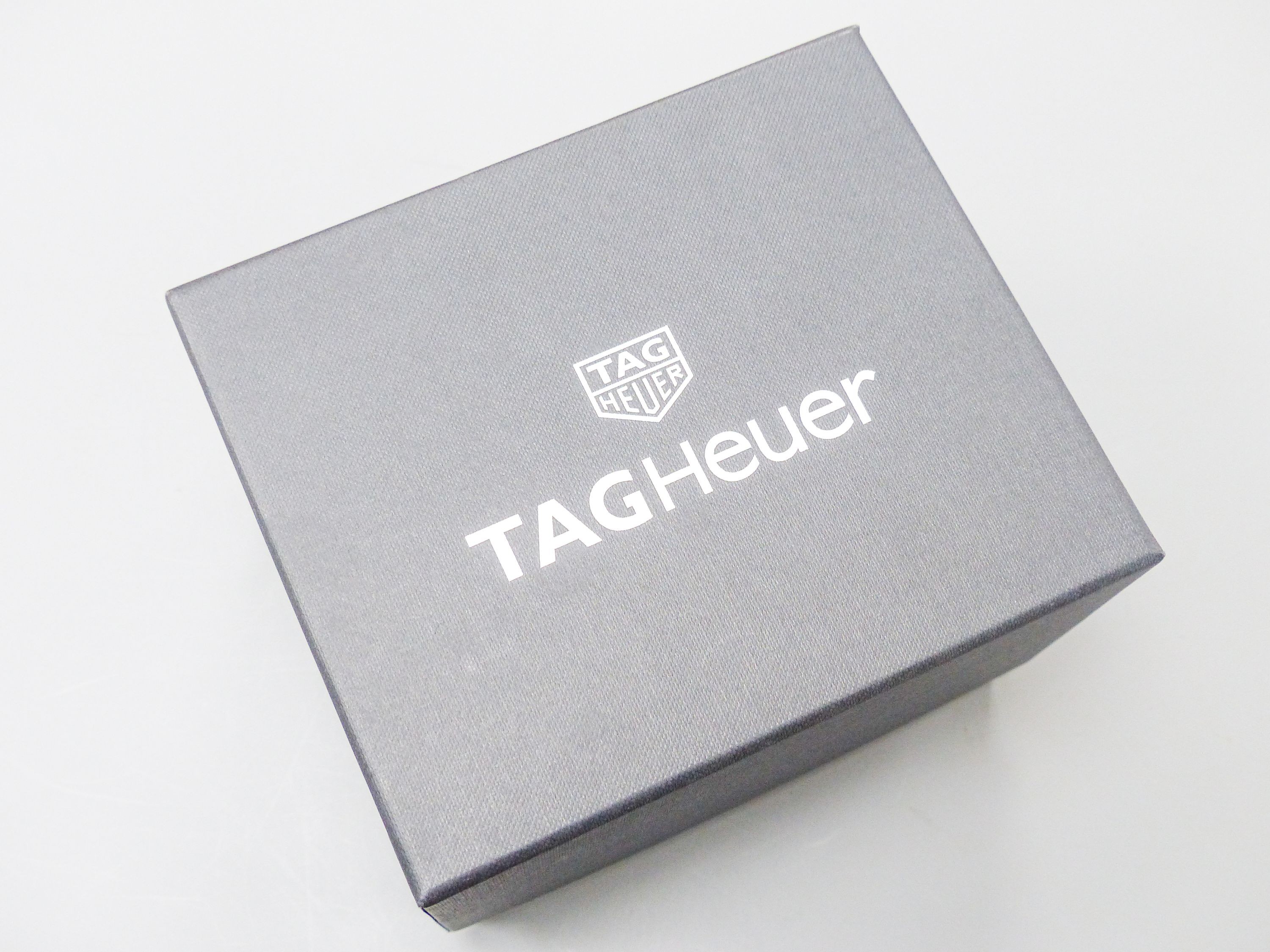 A modern stainless steel Tag Heuer quartz wrist watch with diamond dot numerals, case diameter 32mm, with box.